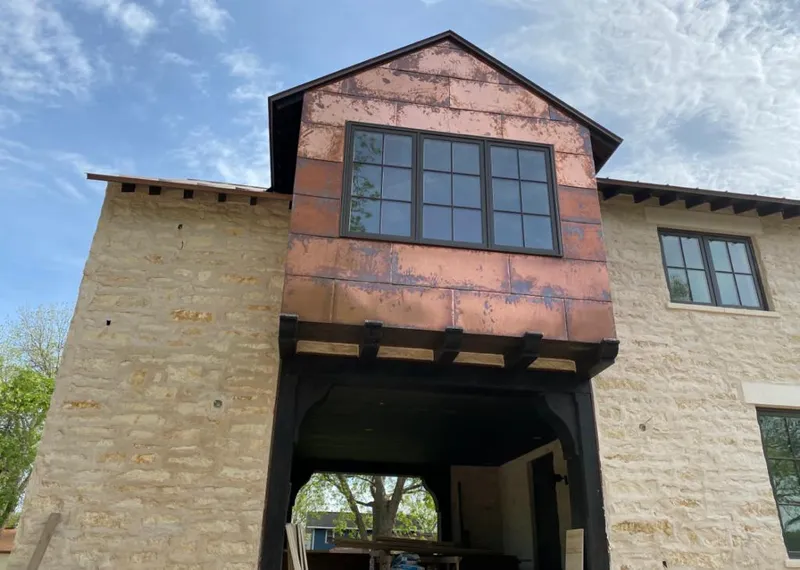 Copper metal panel facade on a stone building for Metal Roof Coating in Struthers